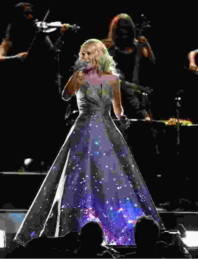 Carrie Underwood Performing Live Onstage, Captivating The Audience. FAME: Carrie Underwood